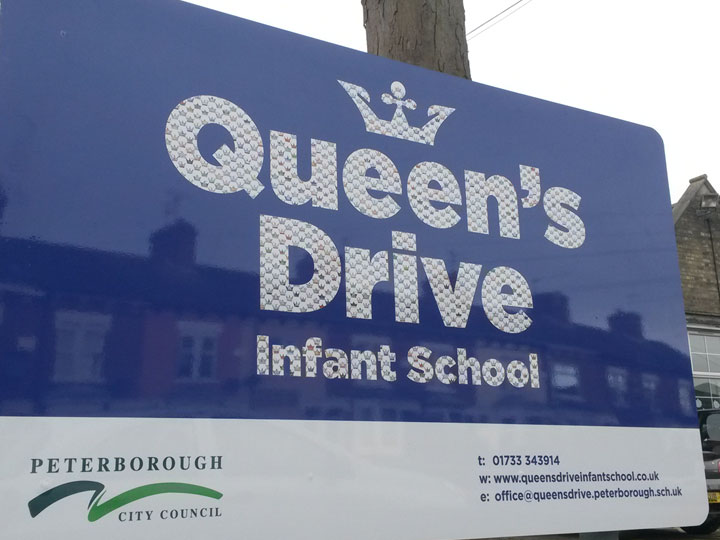 Reflective vinyl letters on aluminium school sign